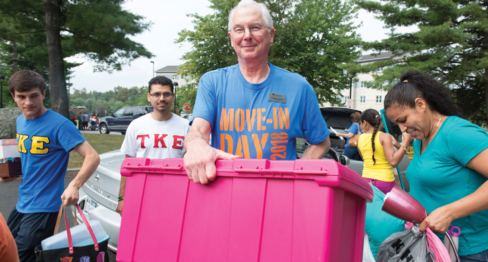 President Christian helping students move into their dorms