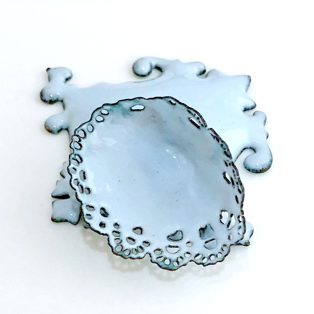 light blue enameled brooch