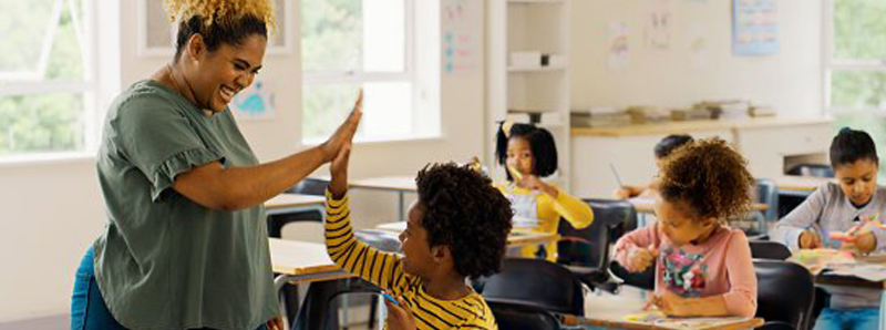 teacher in a classroom with students